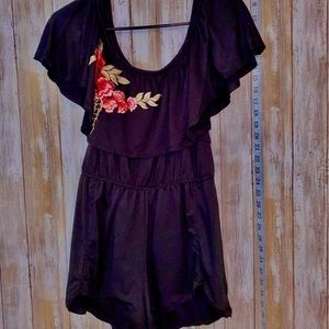 Black romper with rose detailing